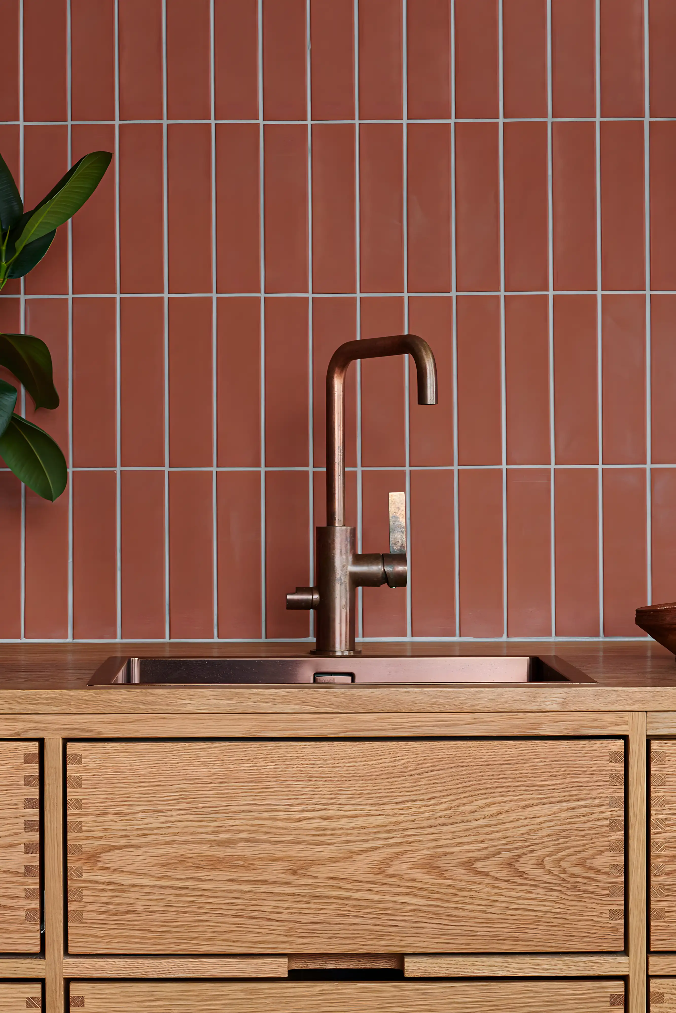 Terracotta Tile Backsplash with Copper Faucet and Oak Cabinetry | Material Depot